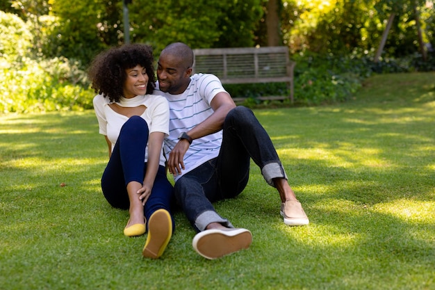 Happy young couple relaxing in the garden