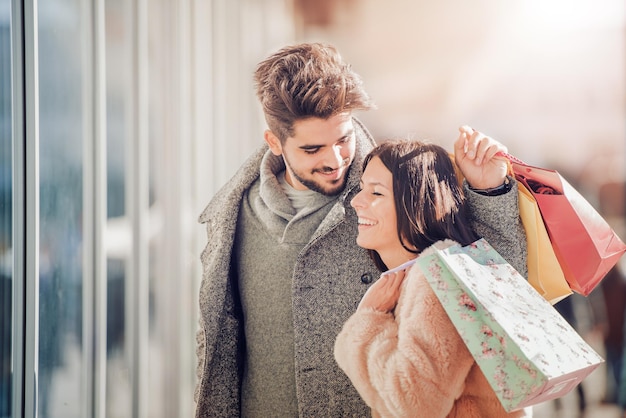 Happy young couple in shopping