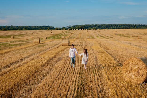 Happy young couple on straw