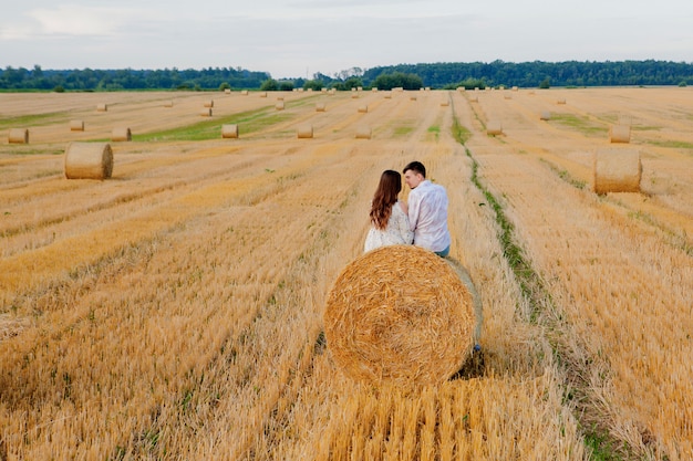 Happy young couple on straw