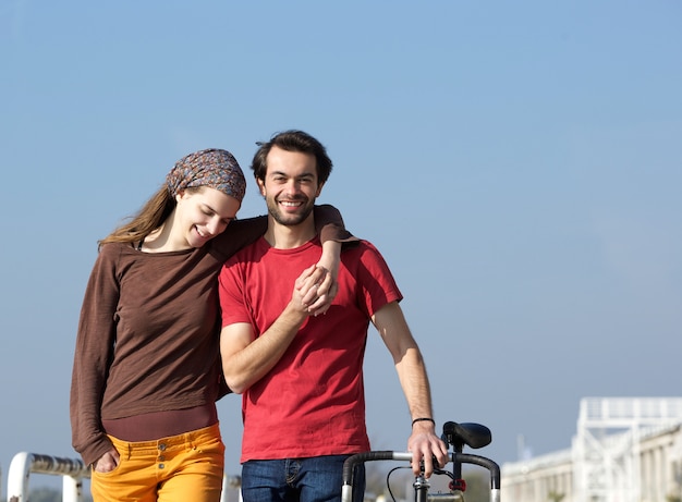 Happy young couple walking outdoors