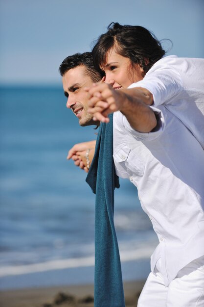 happy young couple in white clothing  have romantic recreation and   fun at beautiful beach on  vacations