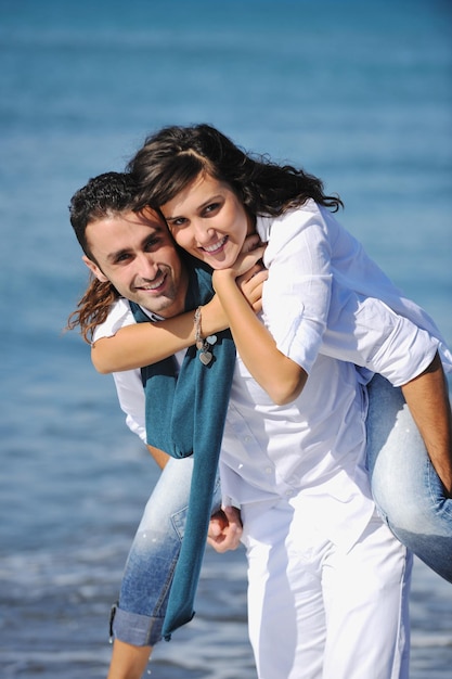 happy young couple in white clothing  have romantic recreation and   fun at beautiful beach on  vacations