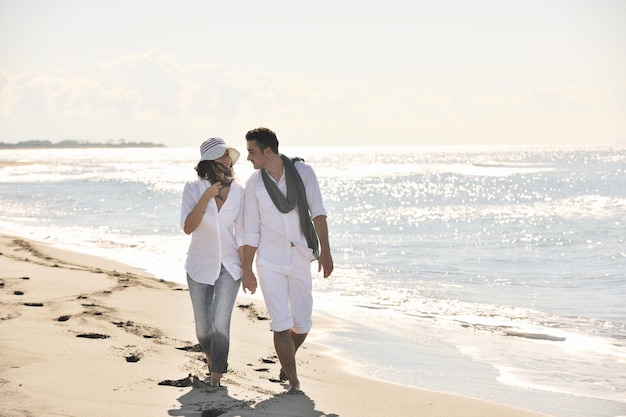 happy young couple in white clothing  have romantic recreation and   fun at beautiful beach on  vacations