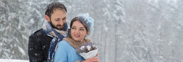 Happy Young Couple in Winter Park. Family outdoors at the castle.