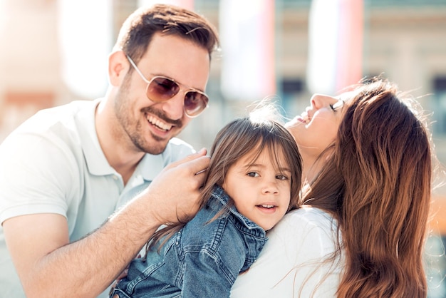 Happy young family in the city