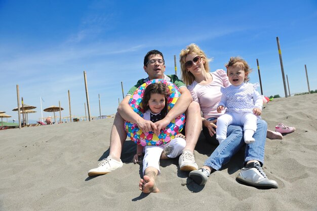 Happy young family have fun and live healthy lifestyle on beach