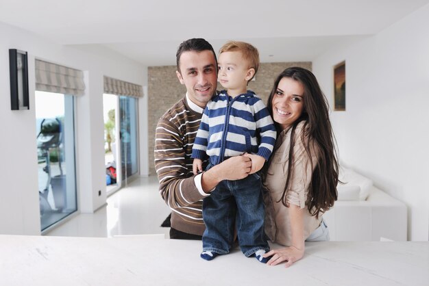 happy young family have fun and relaxing at new home with bright furniture