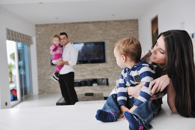 happy young family have fun and relaxing at new home with bright furniture