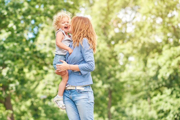 Happy young family relaxing at the park