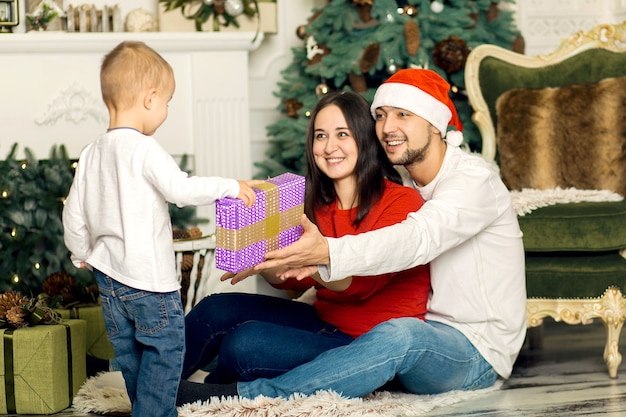 Happy young family spend Christmas holidays together. A fabulous happy childhood.