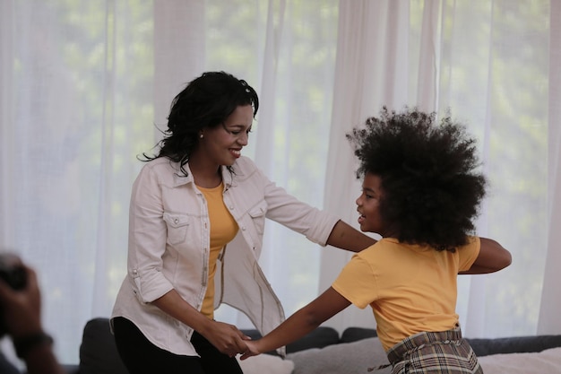 Happy young family spending time together at home