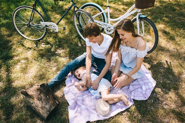 Happy young family spending time together outside