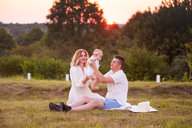 Happy young family summer day outdoor