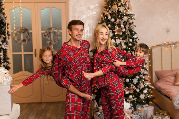 Happy young family with two children smiling 