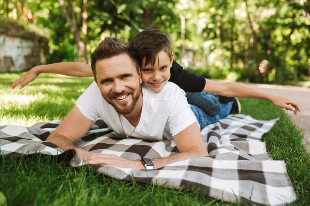 Happy young father have fun with his little son