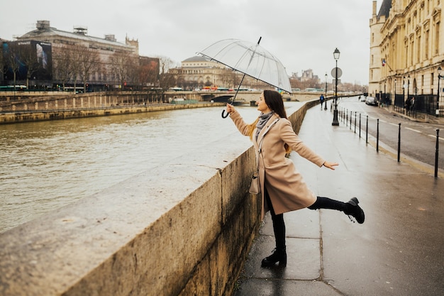 Happy young girl admiring French architecture from Pont au Change