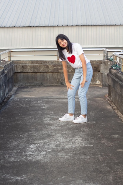 Happy young girl dancing outdoor