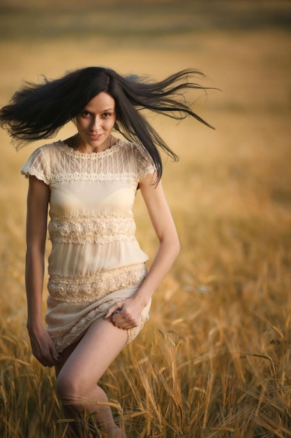 happy young girl in a field and a beautiful woman