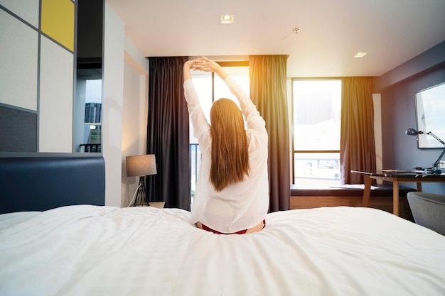 Happy Young Girl Greets New Day with Warm Sunlight Flare