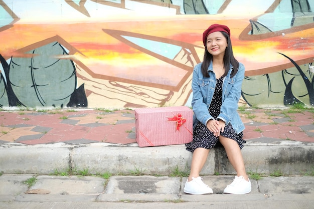 Happy young girl with gift box