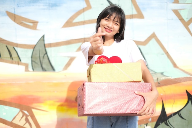 Happy young girl with gift box