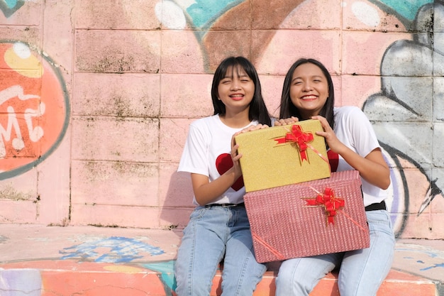 Happy young girl with gift box