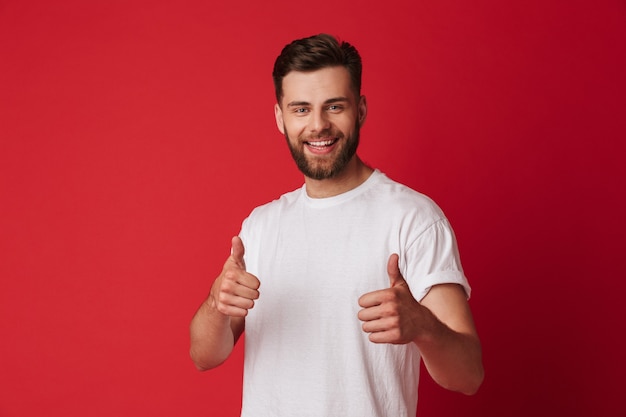 Happy young handsome man showing thumbs up.