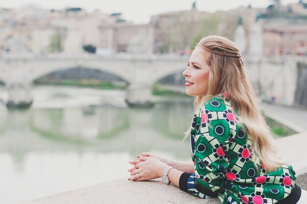 Happy young hipster woman in Rome