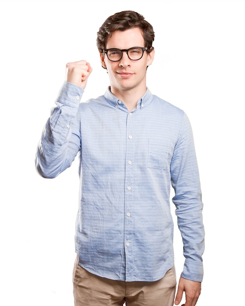 Happy young man doing a powerful gesture