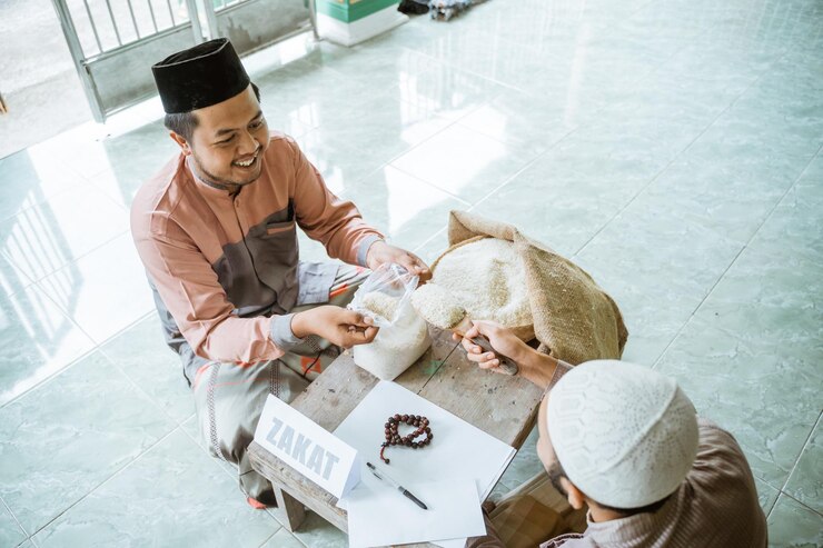 Photo happy young man donating rice at mosque