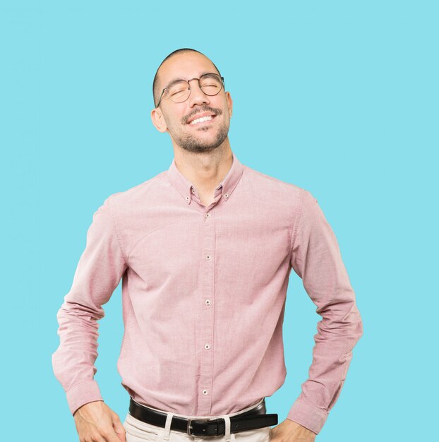 Happy young man laughing