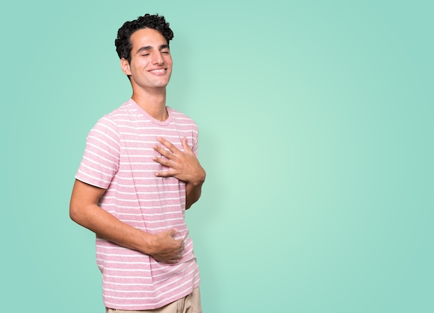 Happy young man laughing