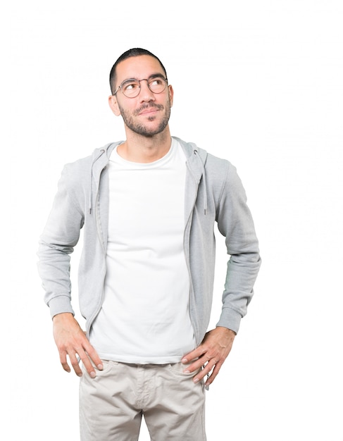 Happy young man looking with glass