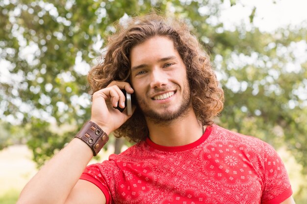 Happy young man on the phone