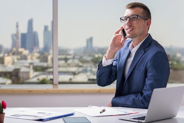 Happy young man on phone