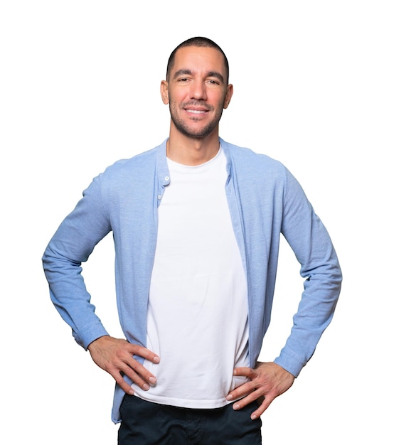 Happy young man posing against background