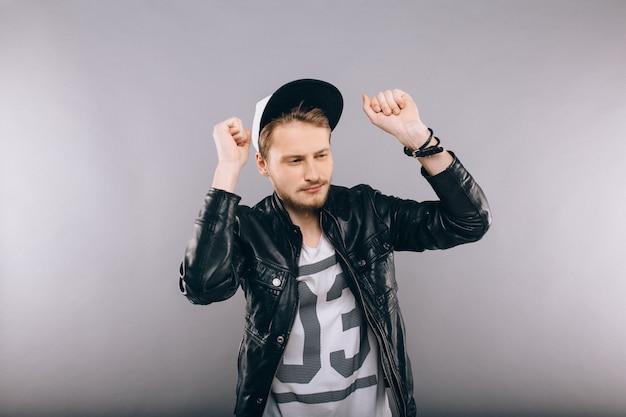 Happy young man in studio on white