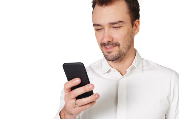 Happy young man using mobile phone