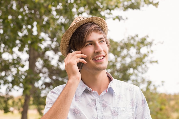 Happy young man using smartphone