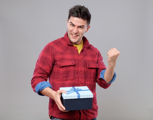 Happy young man with a gift