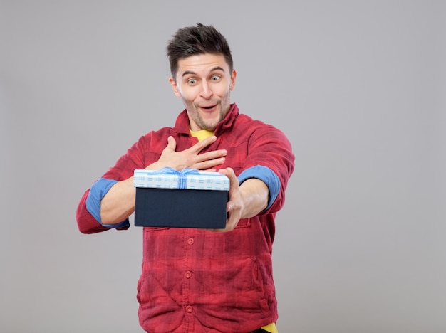 Happy young man with a gift