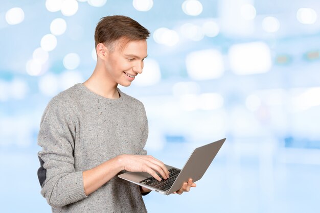 Happy young man with laptop