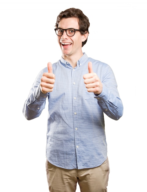 Happy young man with thumbs up