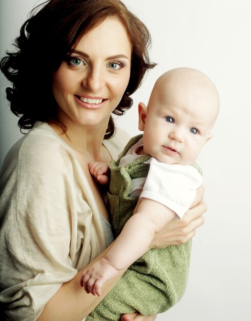 Happy young mother with baby at home