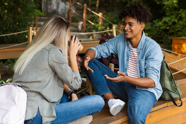 Happy young multiethninc couple talking