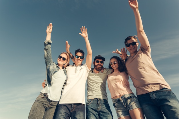 Happy young people group have fun on beach