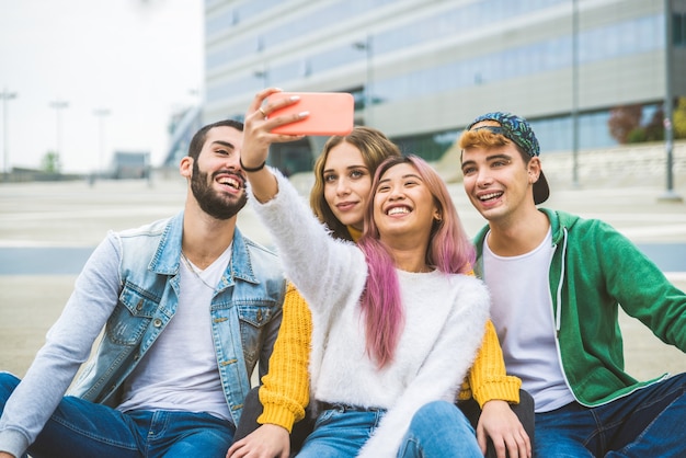 Happy young people meeting outdoors