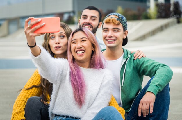 Happy young people meeting outdoors