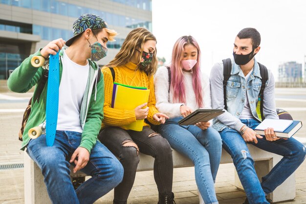 Happy young people meeting outdoors